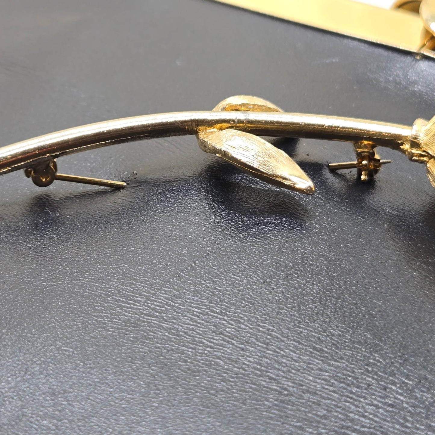 Vintage ETRA navy blue leather clutch bag with tulip bud Brooch pin and gold tone chain