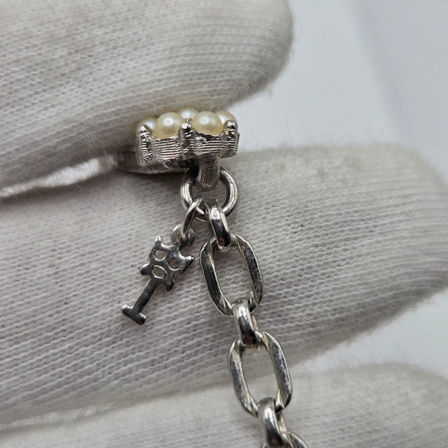 Vintage TRIFARI CROWN signed Ribbon Faux Pearls Brushed Silver tone Necklace and flower clip on earrings set