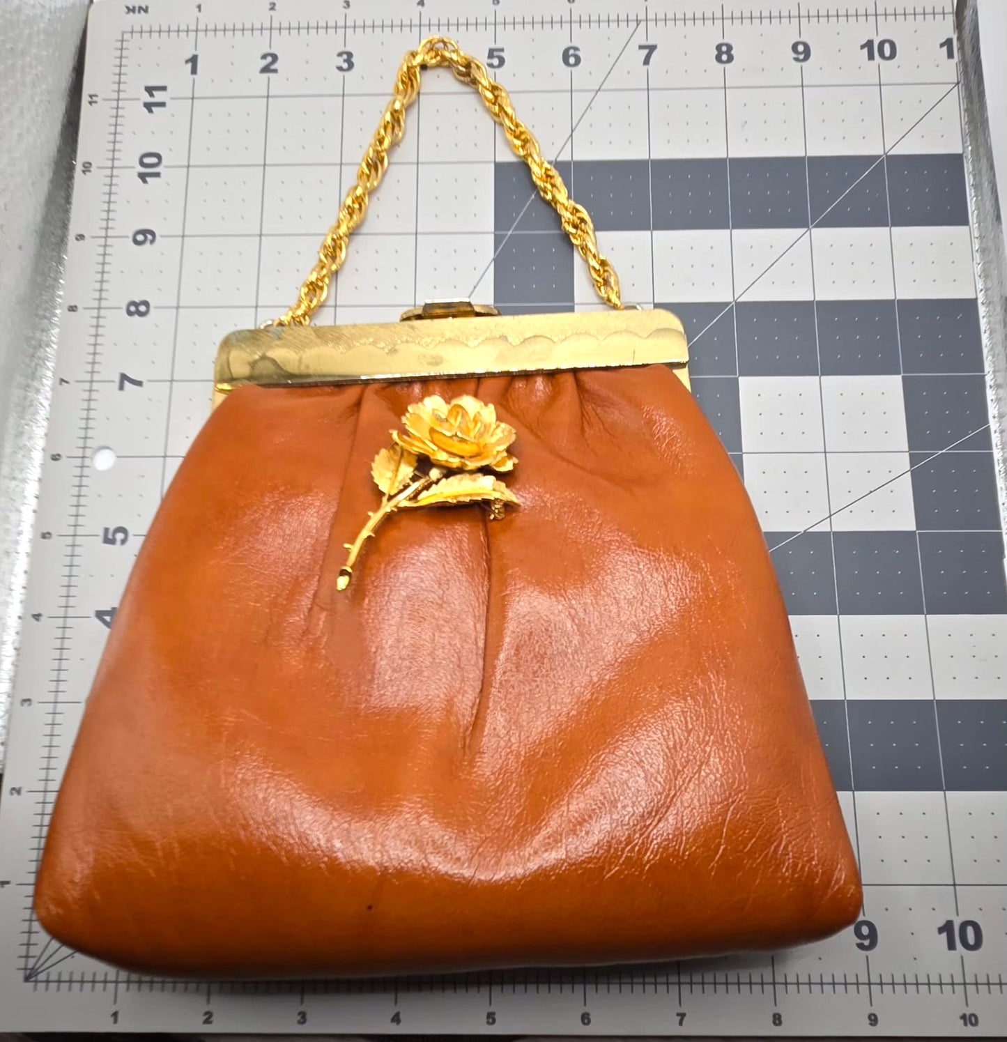 Vintage orange brown leather handbag with MONET Rose brooch pin and gold tone chain