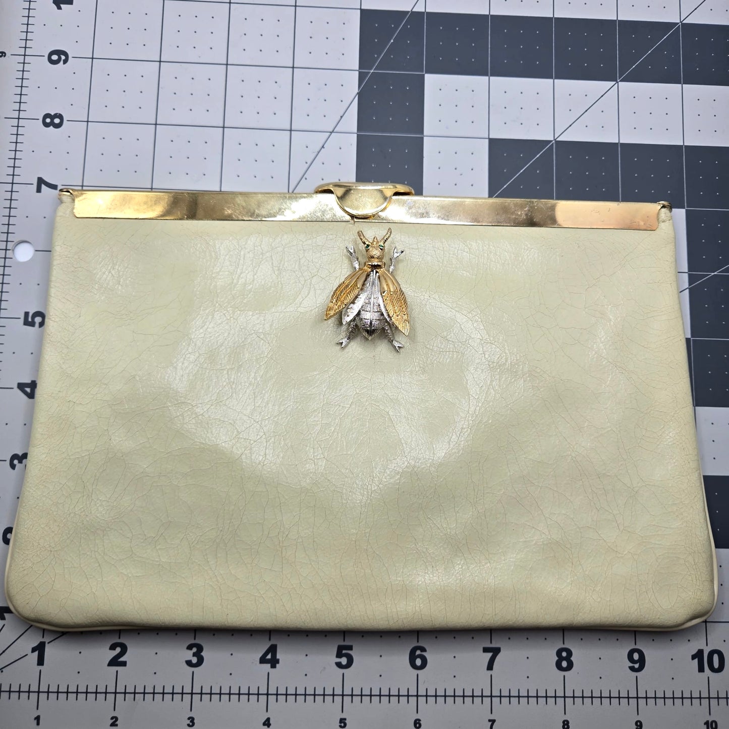 Vintage cream leather clutch bag with MONET Fly Bug Brooch pin and gold tone chain