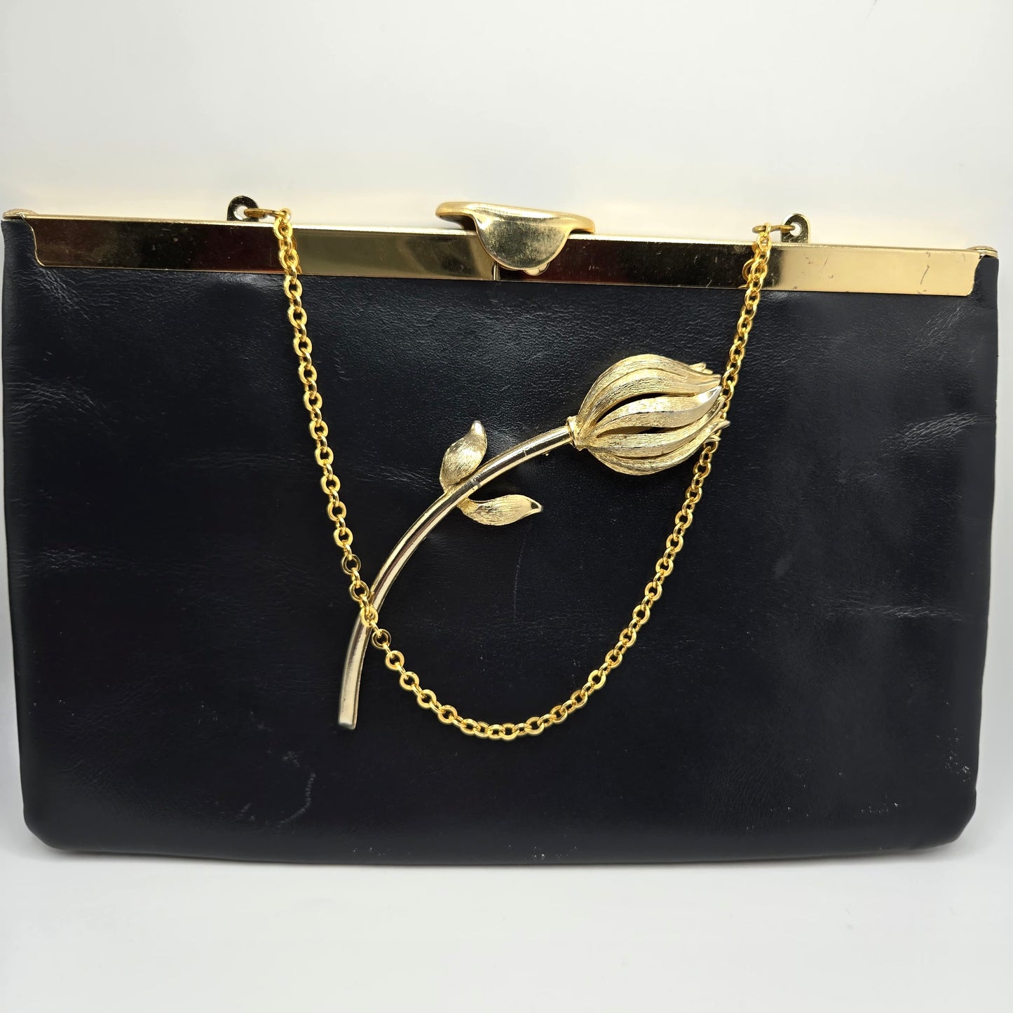 Vintage ETRA navy blue leather clutch bag with tulip bud Brooch pin and gold tone chain