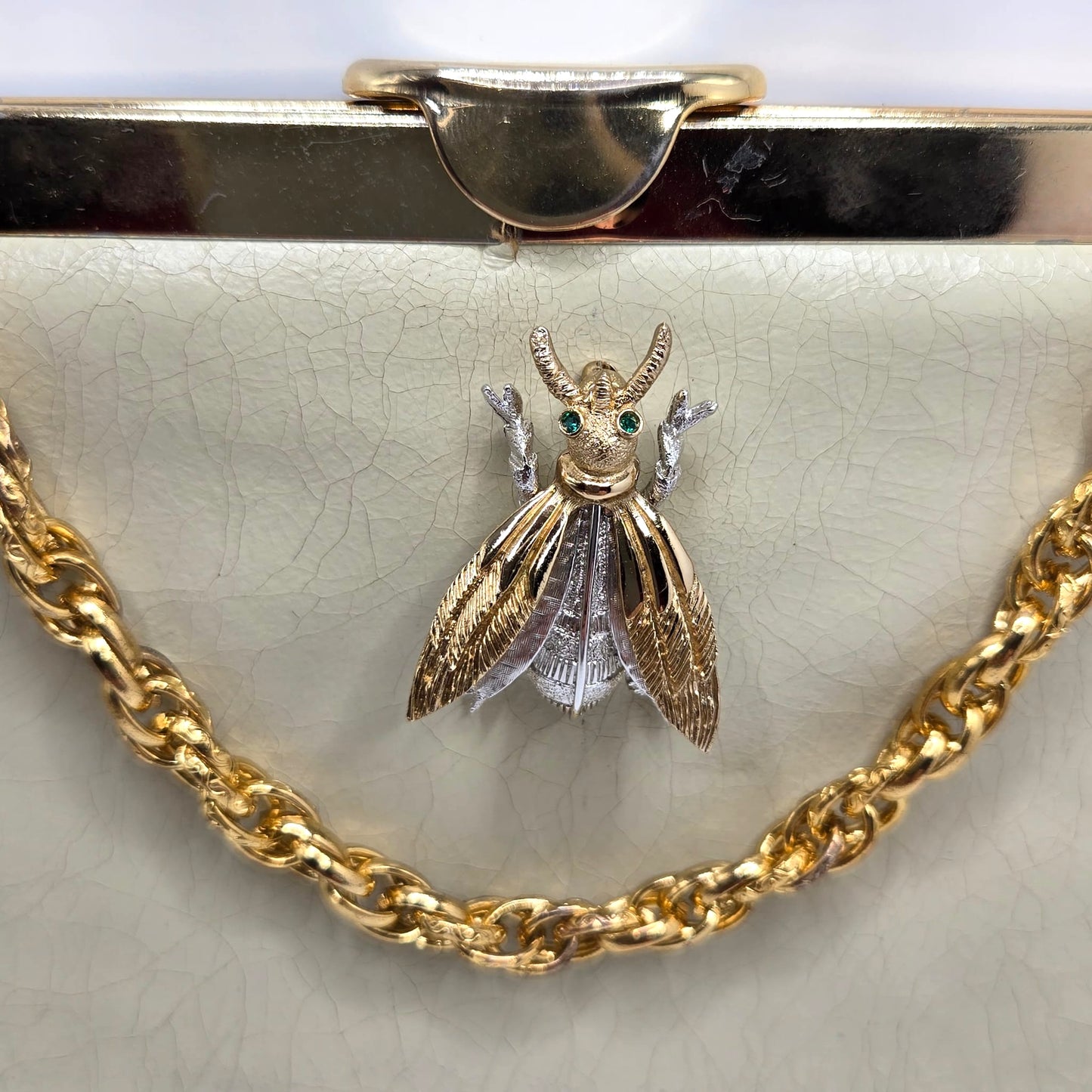 Vintage cream leather clutch bag with MONET Fly Bug Brooch pin and gold tone chain
