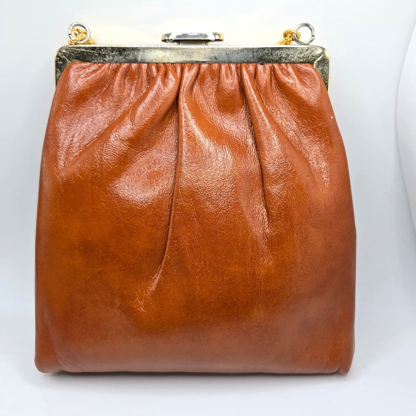 Vintage orange brown leather handbag with MONET Rose brooch pin and gold tone chain
