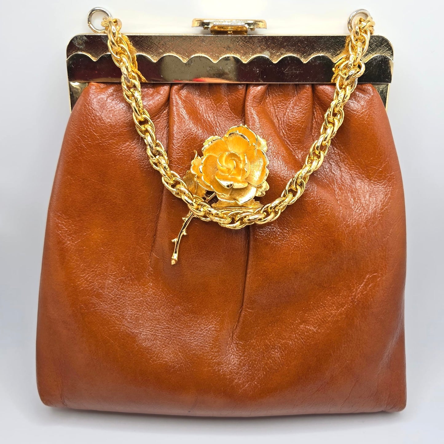 Vintage orange brown leather handbag with MONET Rose brooch pin and gold tone chain