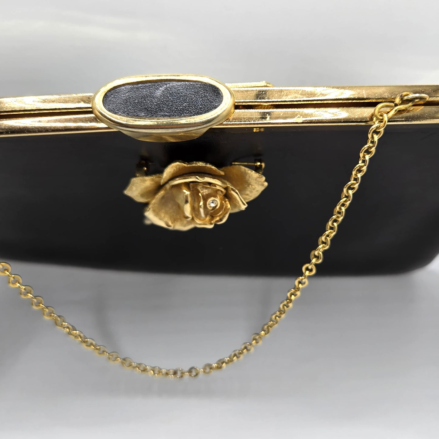 Vintage ETRA black leather clutch bag with ROSE Brooch pin and gold tone chain