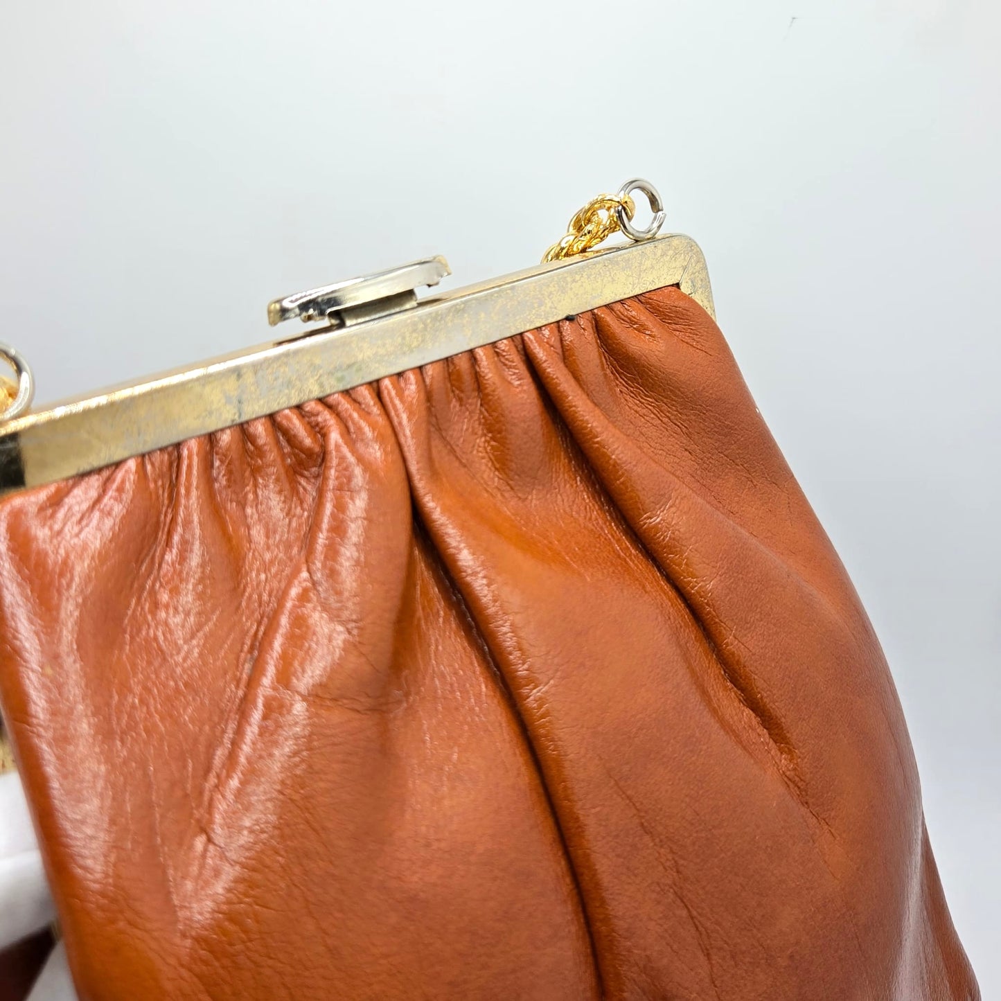 Vintage orange brown leather handbag with MONET Rose brooch pin and gold tone chain