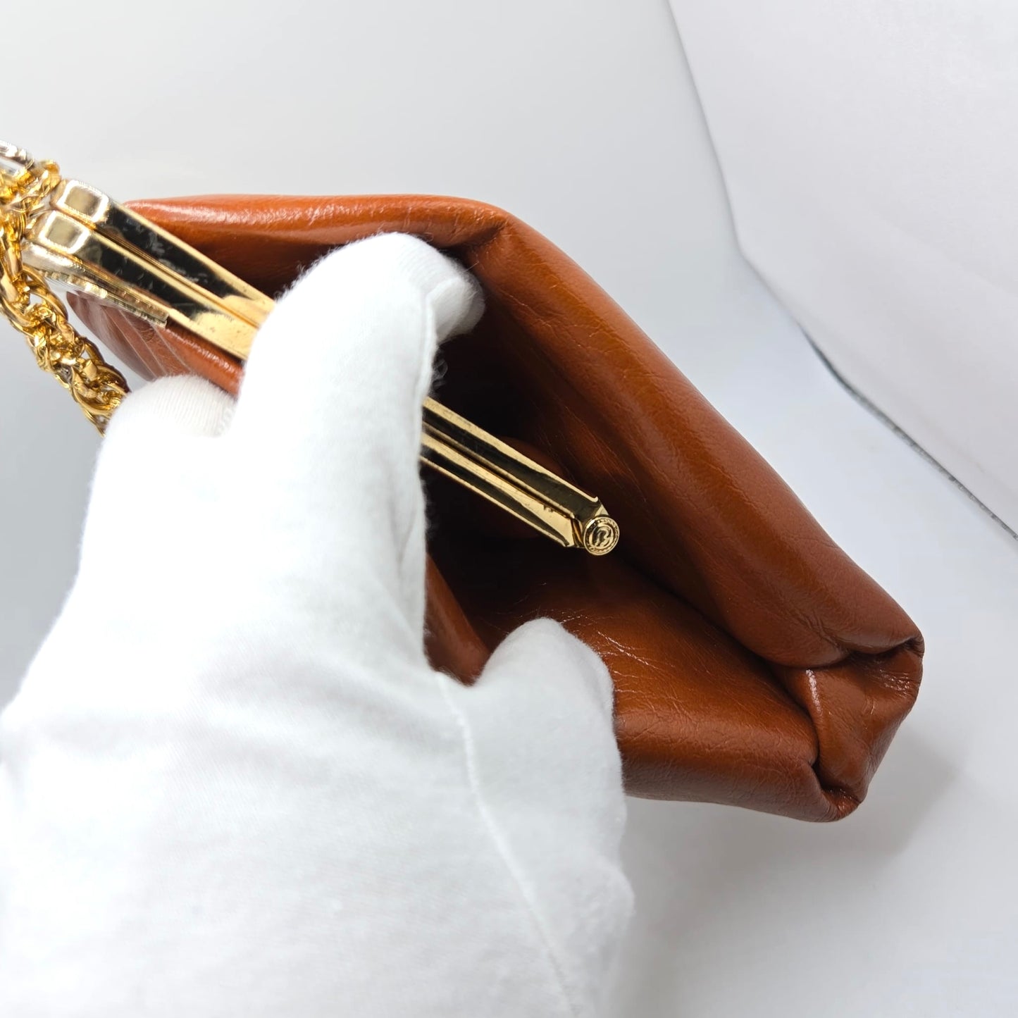 Vintage orange brown leather handbag with MONET Rose brooch pin and gold tone chain