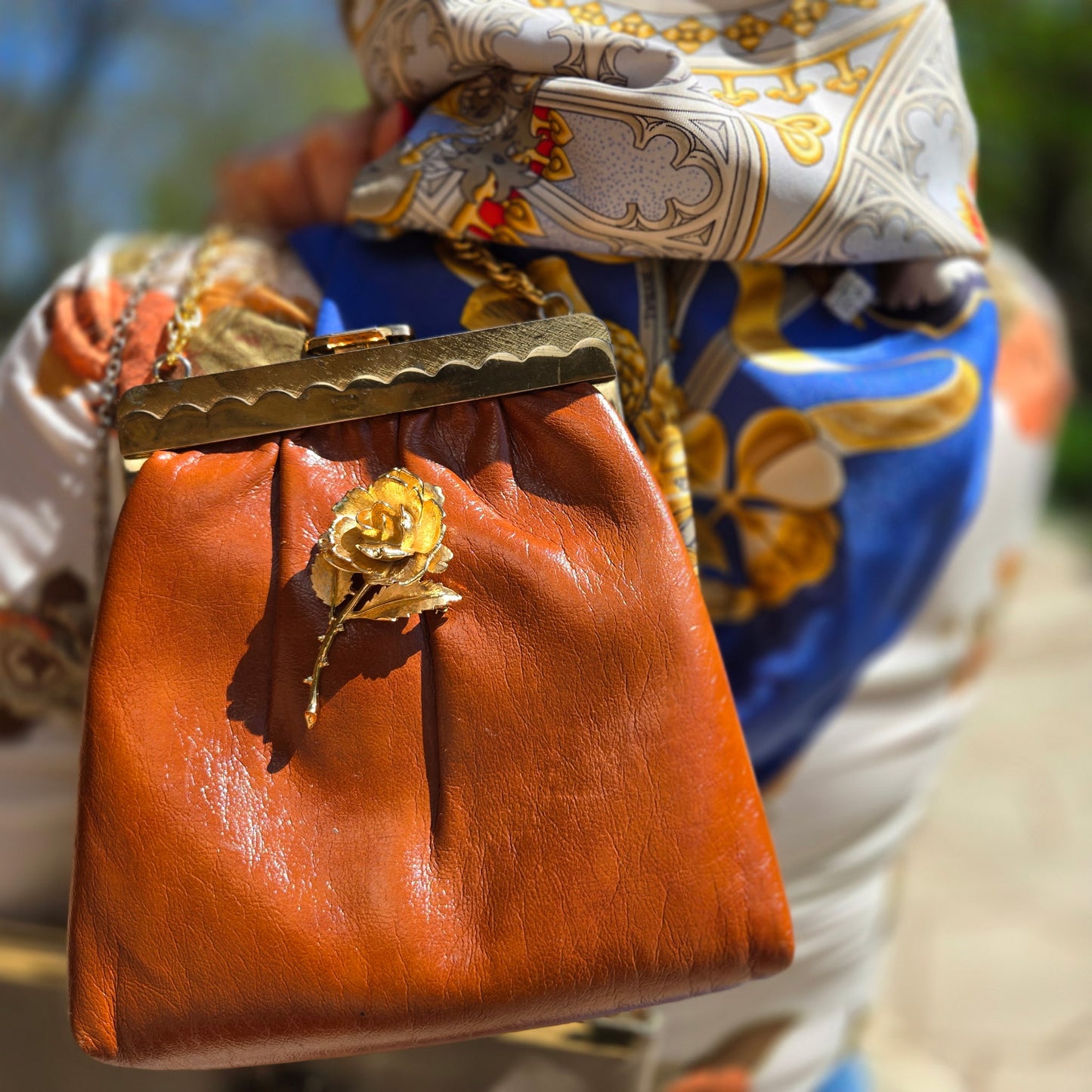 Vintage orange brown leather handbag with MONET Rose brooch pin and gold tone chain