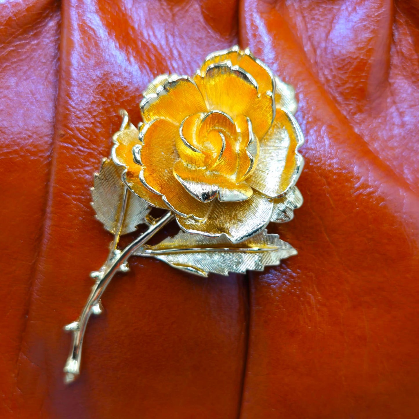 Vintage orange brown leather handbag with MONET Rose brooch pin and gold tone chain