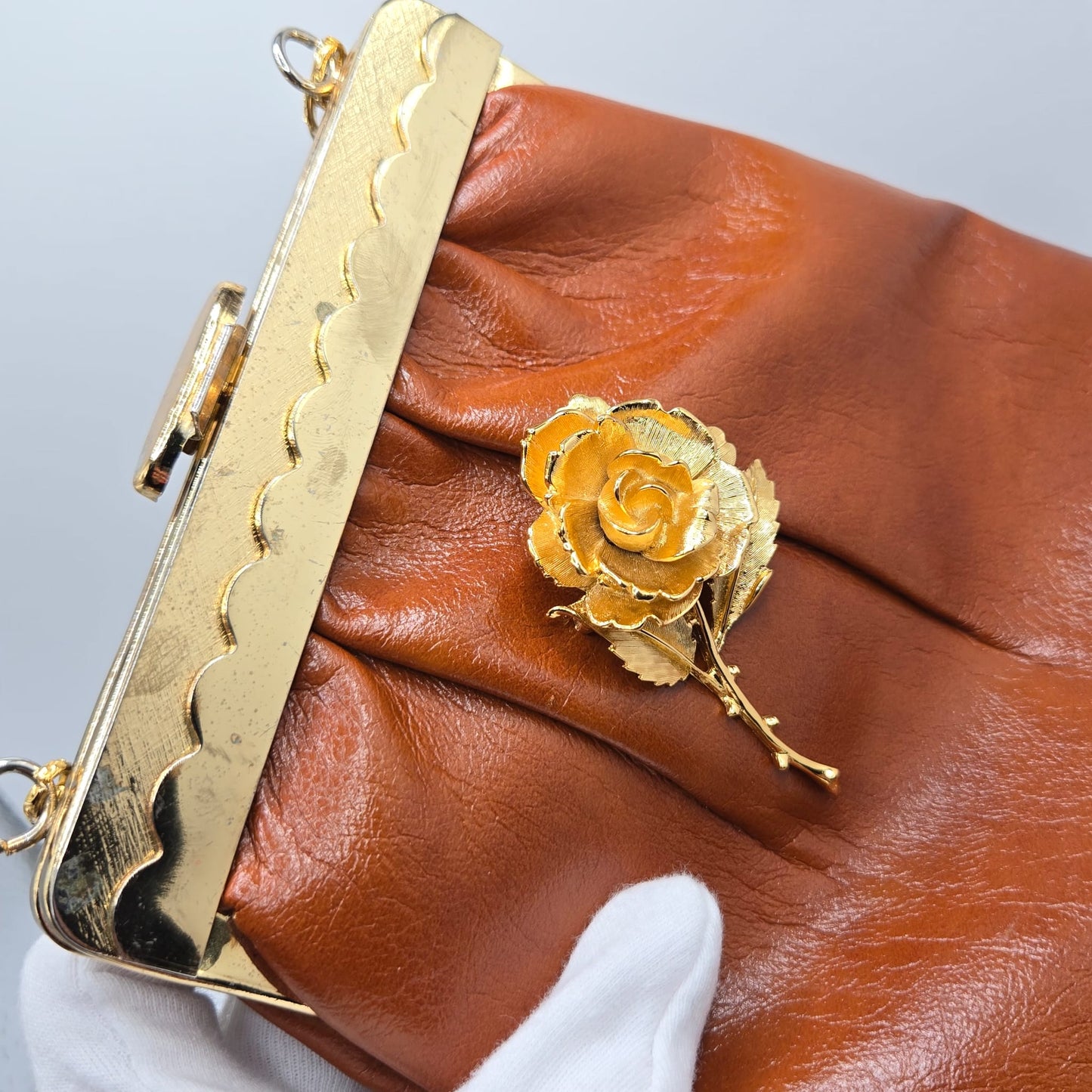 Vintage orange brown leather handbag with MONET Rose brooch pin and gold tone chain