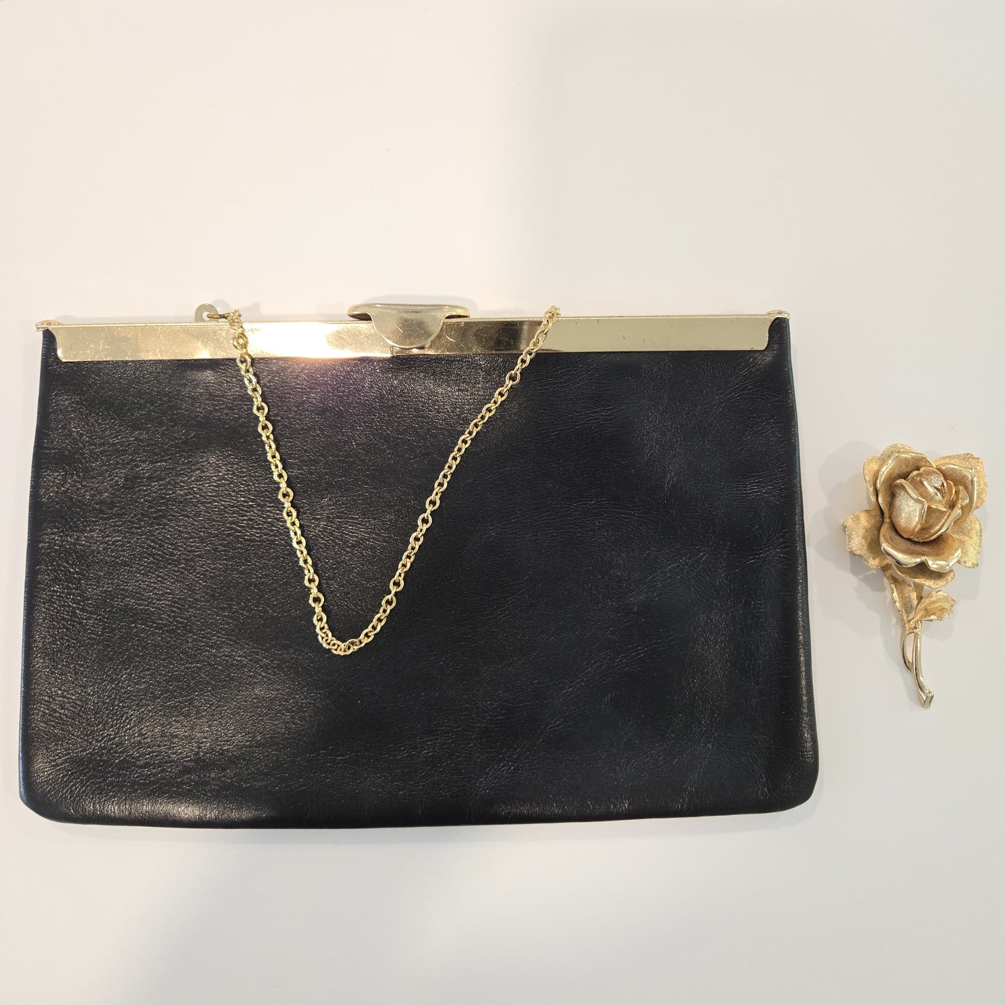 Vintage ETRA black leather clutch bag with ROSE Brooch pin and gold tone chain