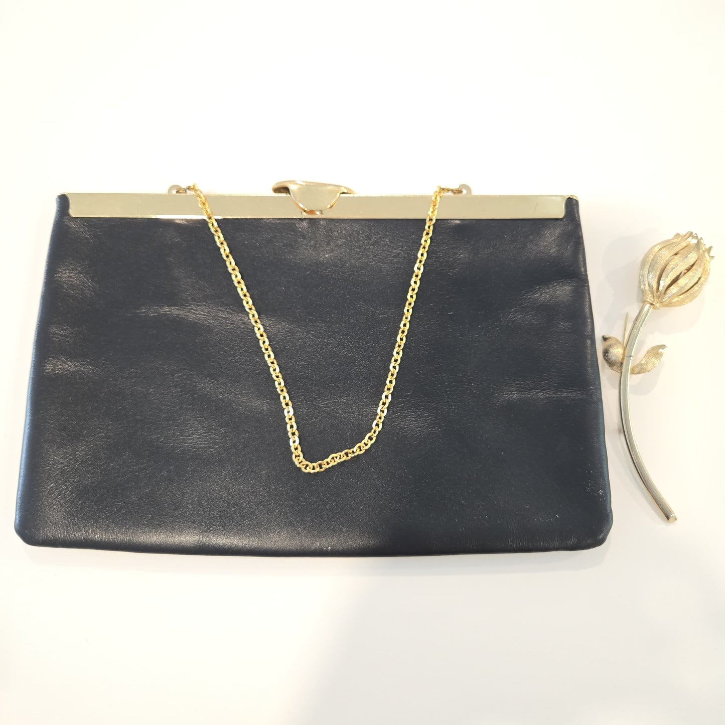Vintage ETRA navy blue leather clutch bag with tulip bud Brooch pin and gold tone chain