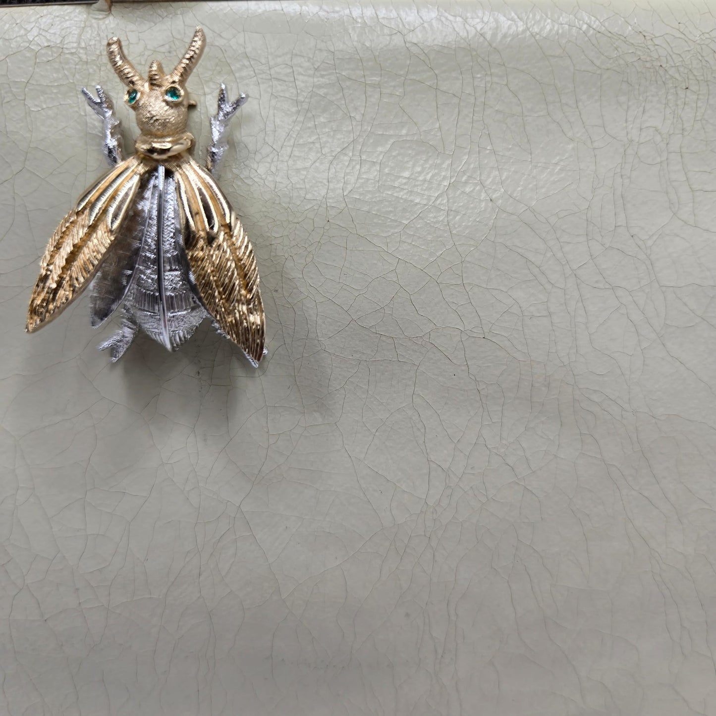 Vintage cream leather clutch bag with MONET Fly Bug Brooch pin and gold tone chain