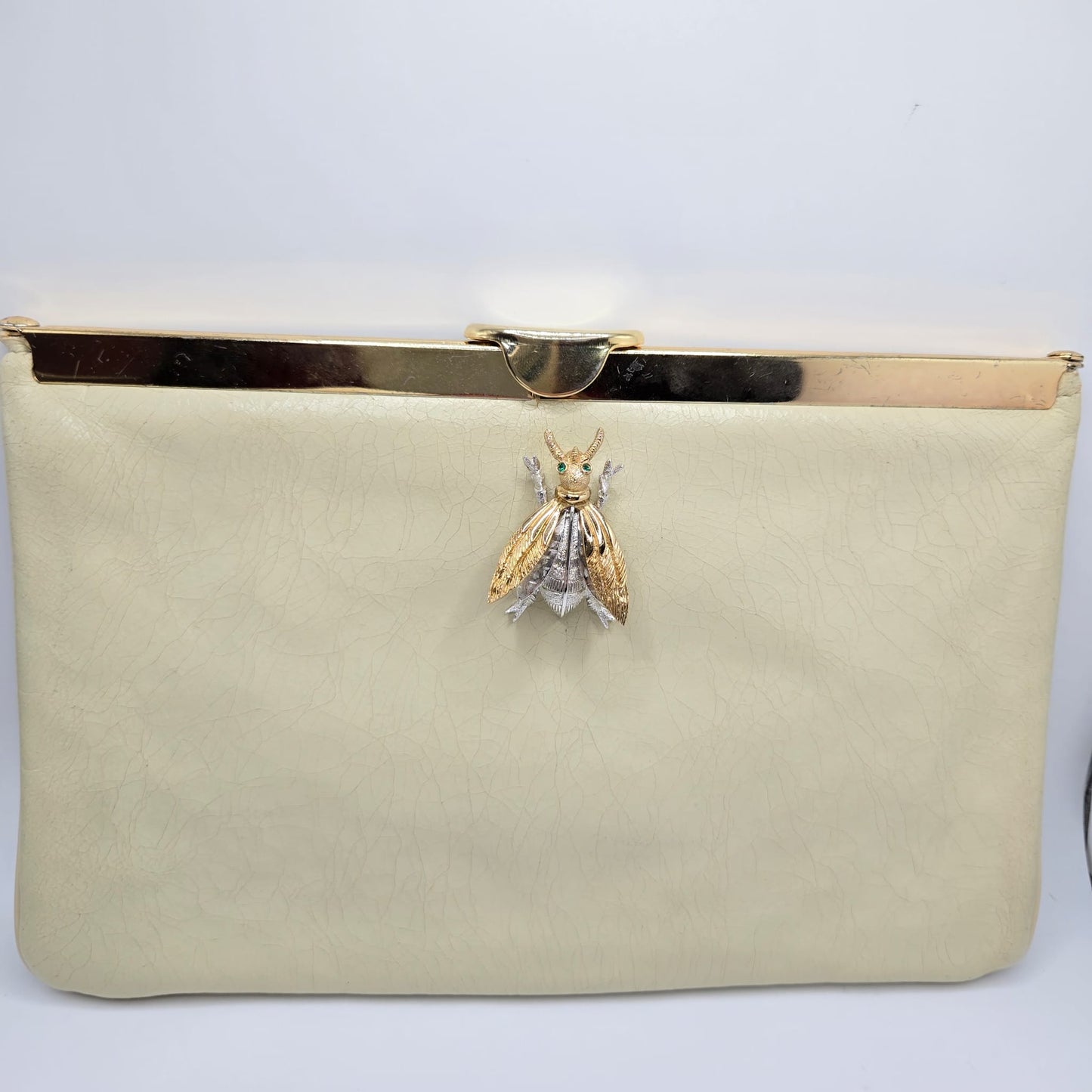 Vintage cream leather clutch bag with MONET Fly Bug Brooch pin and gold tone chain