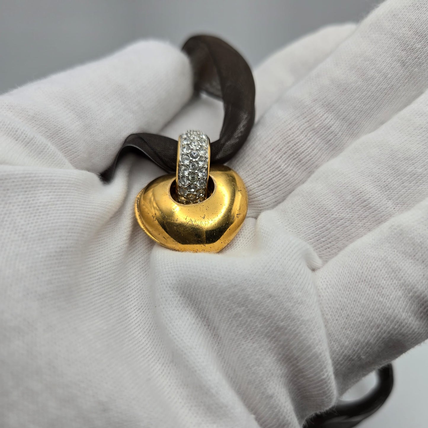 Vintage SWAROVSKI Swan Signed Gold Tone Pendant Necklace, Heart Splits Into Two with Red Crystal Heart Inside, Brown Ribbon