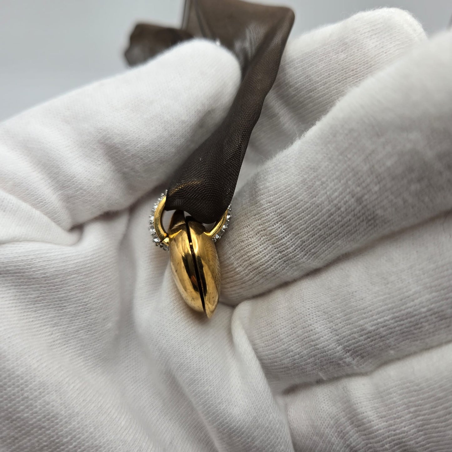 Vintage SWAROVSKI Swan Signed Gold Tone Pendant Necklace, Heart Splits Into Two with Red Crystal Heart Inside, Brown Ribbon